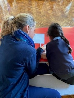 Adult and child reading together
